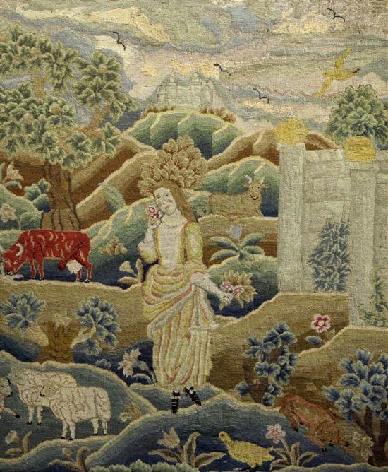 An 18th century needlework panel depicting a shepherdess in a landscape, 26.5 x 22in.